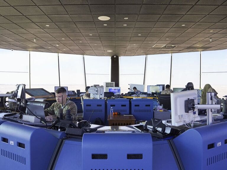 air traffic controllers Air traffic controllers working in a tower.