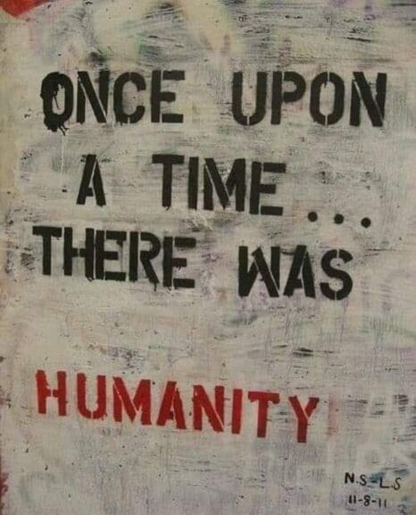 A board painted white with text about humanity