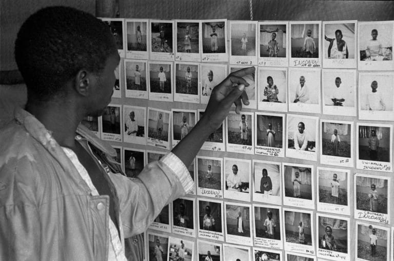 rwandan genocide Rwandan genocide victims photos on a wall.
