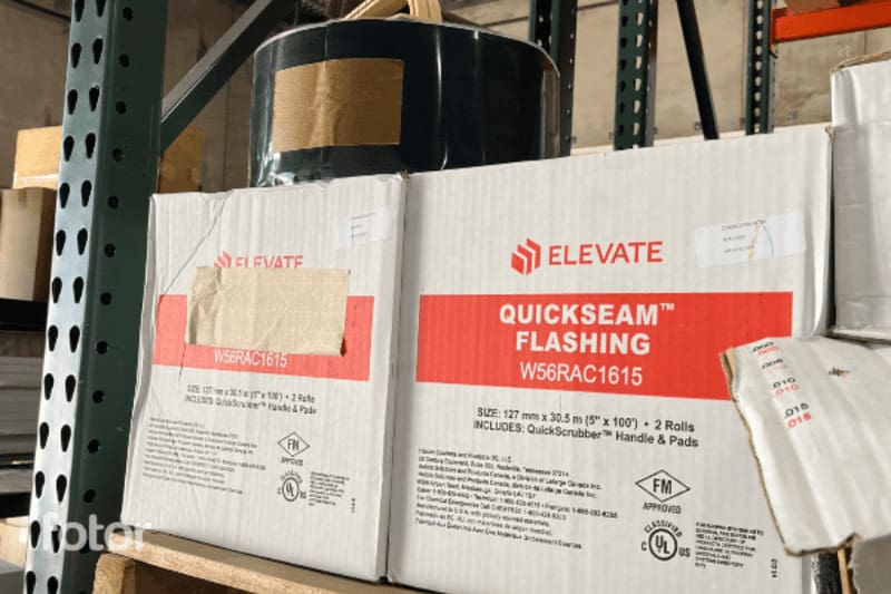 Boxes of roofing material on a supply shelf