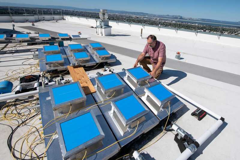 Researcher testing radiative cooling film
